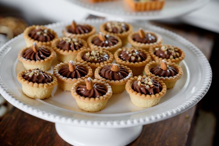 Mini chocolate-hazelnut tartlets topped with almonds