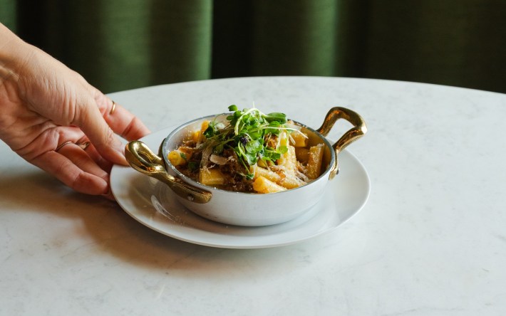 Small pot of rigatoni topped with microgreens at L’Olivo Calgary