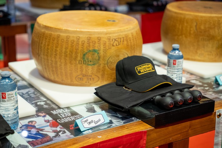 Parmigiano Reggiano hat and cheese cracking tools on table