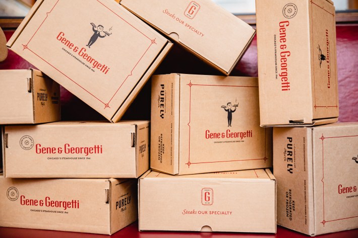 Stacked Gene & Georgetti delivery boxes ready for nationwide shipping