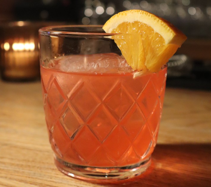 Close-up of a Negroni cocktail with orange slice at Vallata