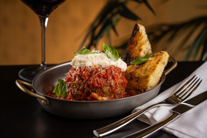 Wagyu meatball topped with whipped ricotta and basil at ai Pazzi