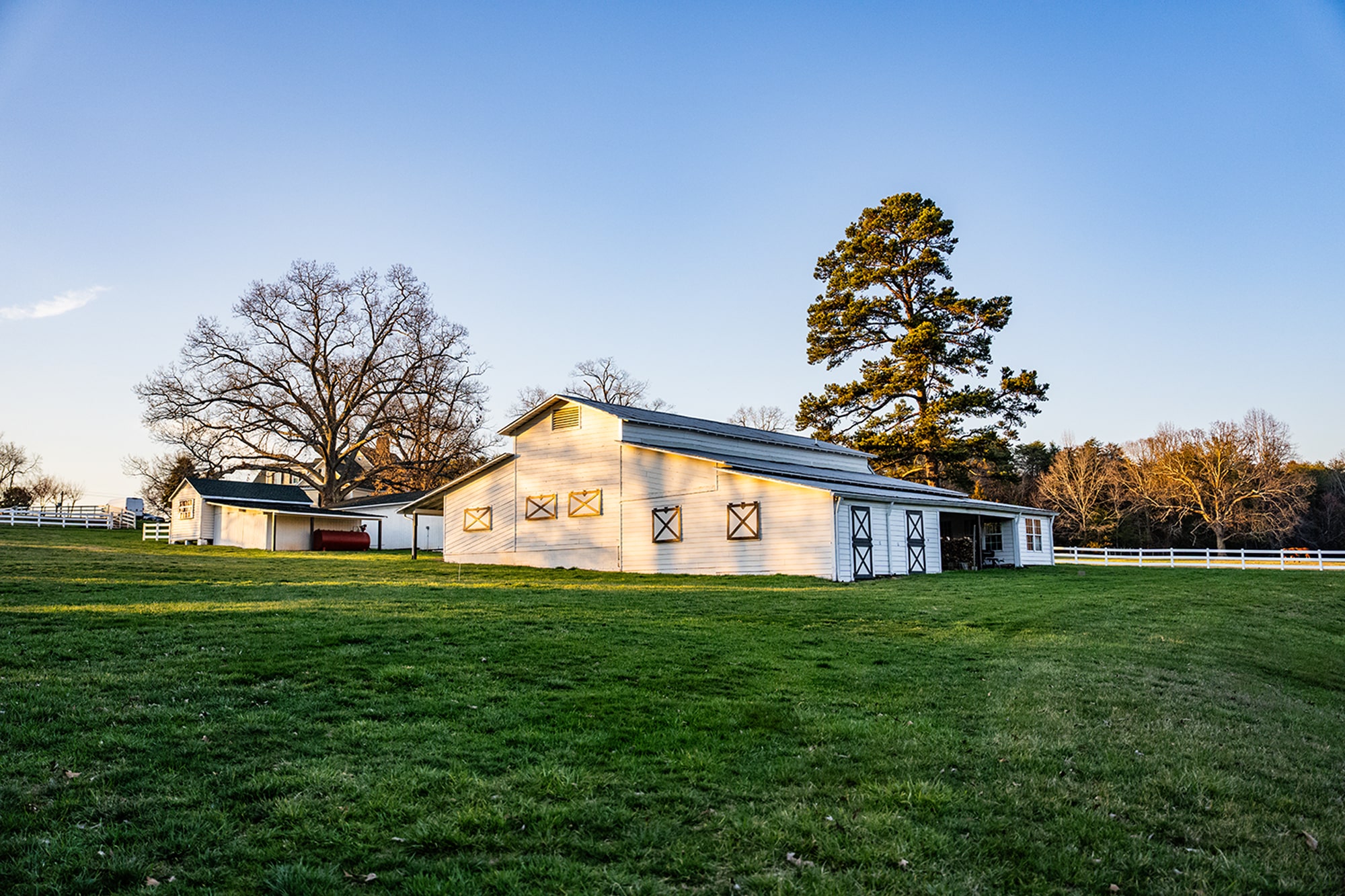 White barn at Rollingwood Farms in North Carolina countryside.