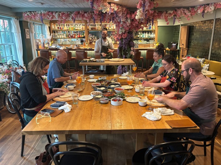 Diners participating in a pizza making class at Frannie & The Fox Charleston