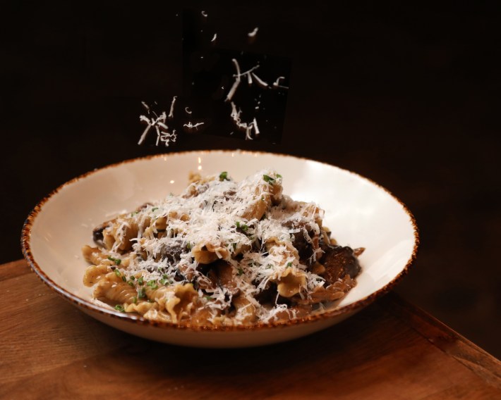Fusilli-style pasta with mushrooms and fresh shaved cheese.