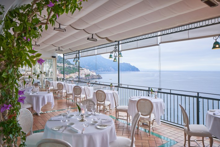 White tablecloth settings overlooking the Mediterranean frin Glicine.
