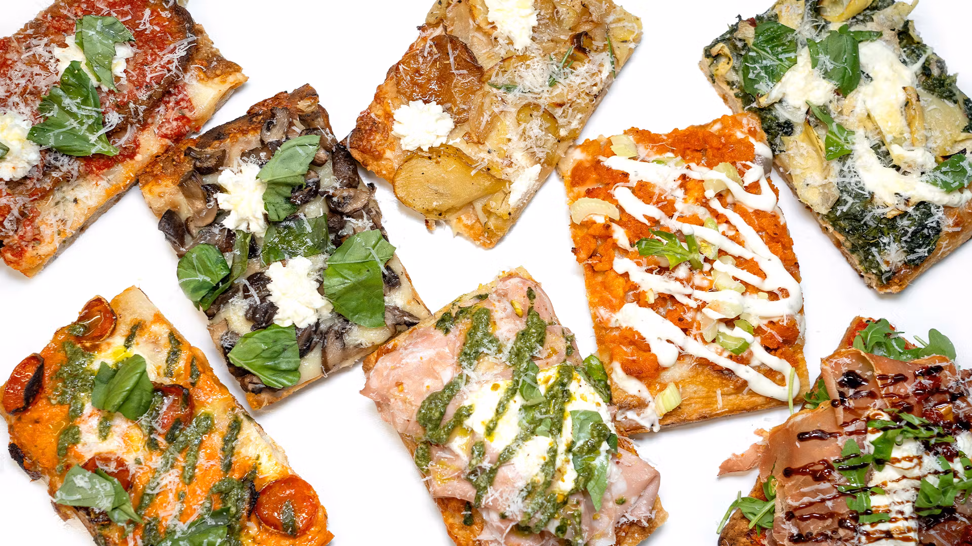 Assorted rectangular slices of Roman-style pizza.