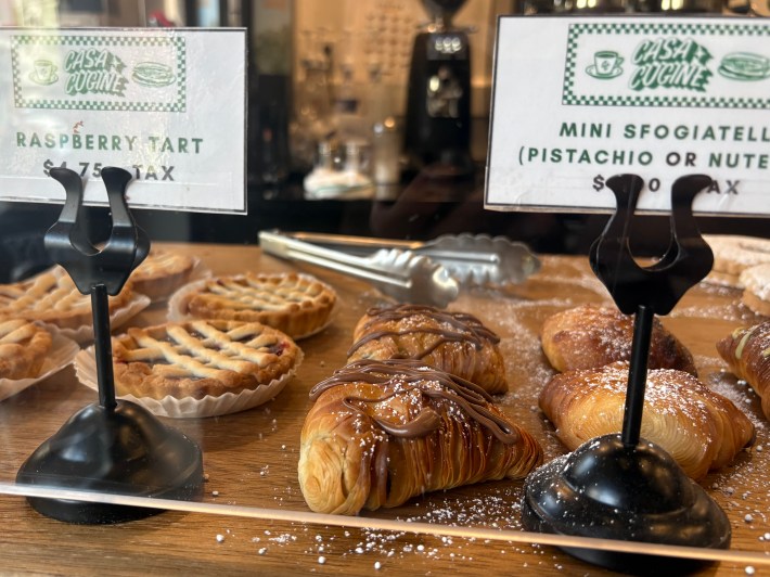 Casa Cugine’s pastry case featuring sfogliatelle and tarts.