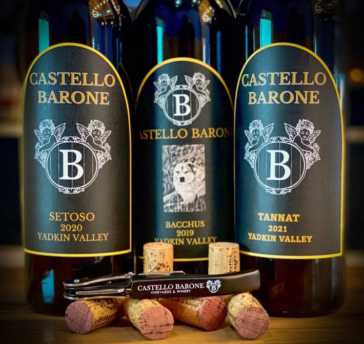 Castello Barone wine bottles featuring Setoso, Bacchus, and Tannat labels.
