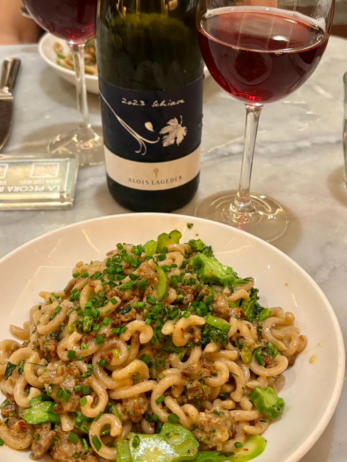 Alois Lageder Schiava paired with Gramigna pasta in a sauce of sausage, broccolini, and chili flakes.