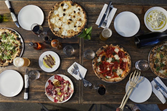 An array of available dishes and drinks on the menu at Roberta's.