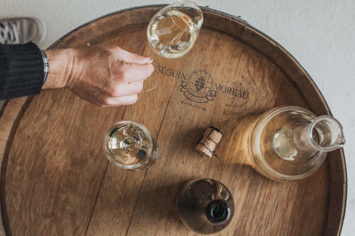 Champagne Telmont glasses and decanter on a Seguin Moreau barrel