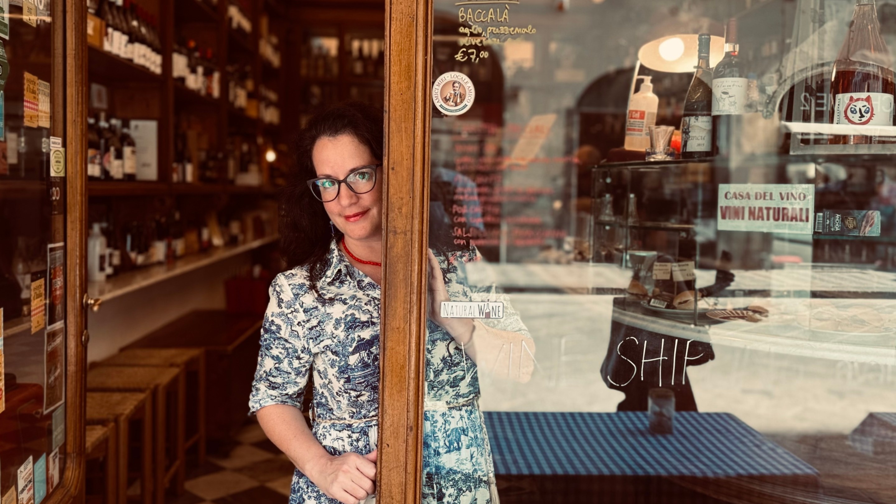 Toni Mazzaglia standing in the doorway of a Florentine wine shop