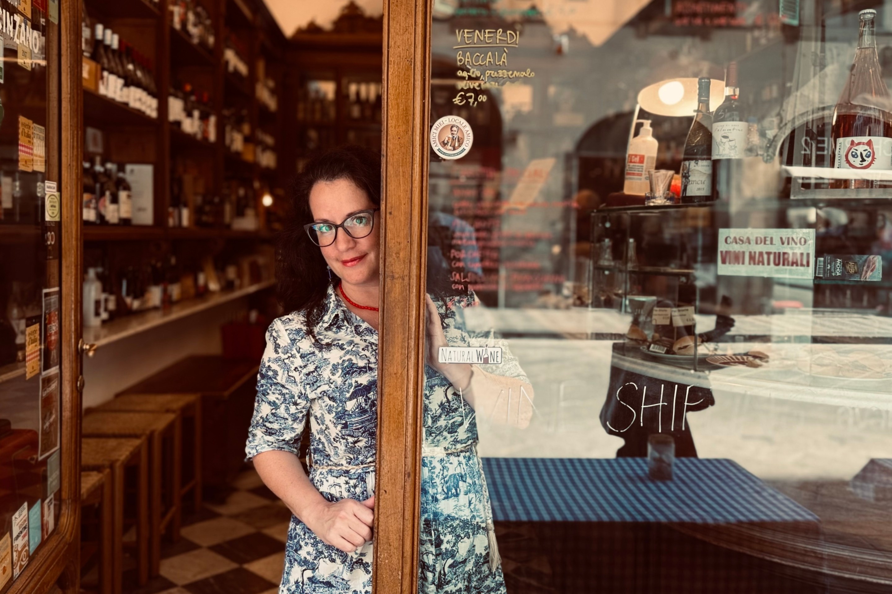 Toni Mazzaglia standing in the doorway of a Florentine wine shop