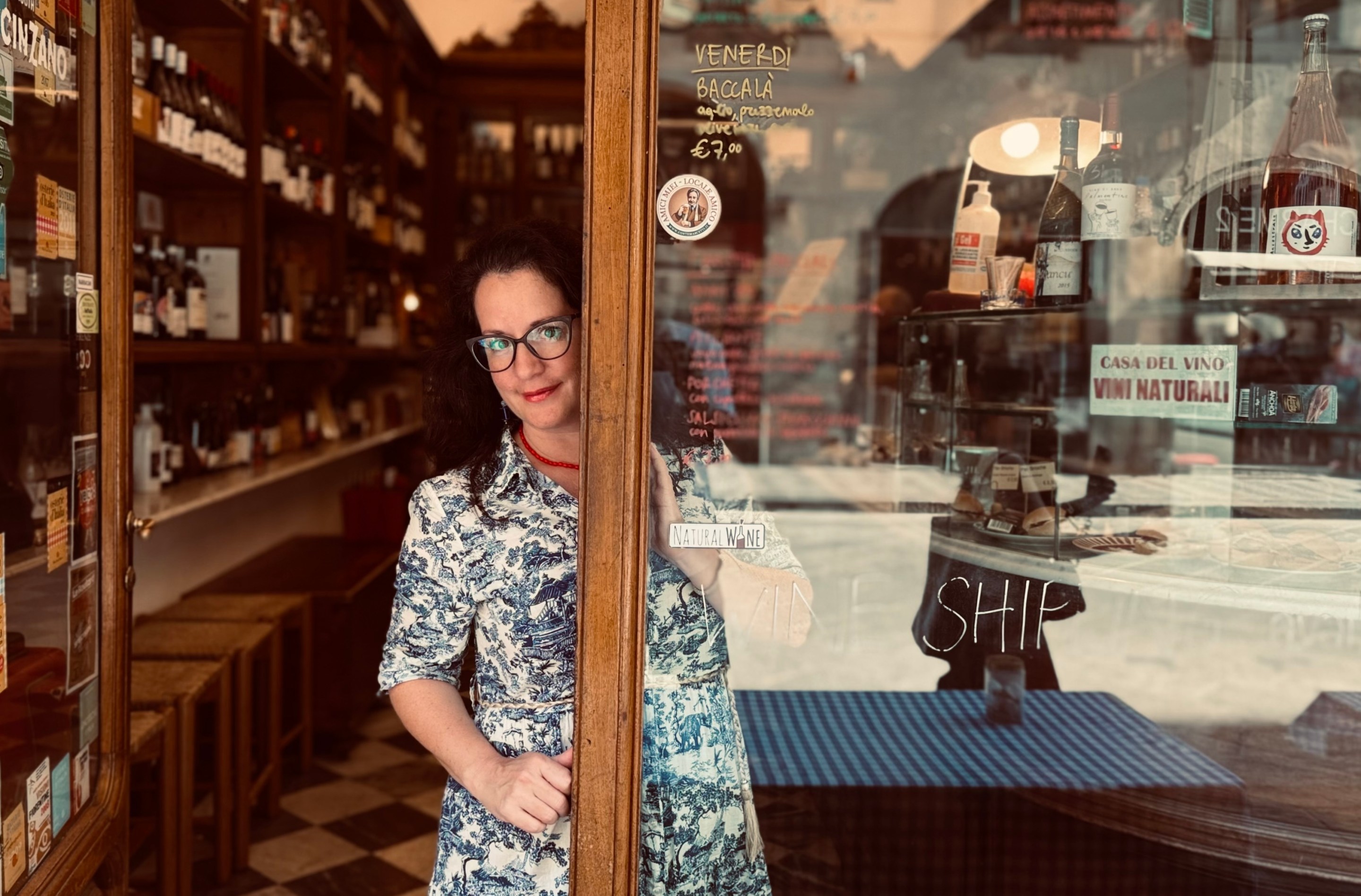 Toni Mazzaglia standing in the doorway of a Florentine wine shop