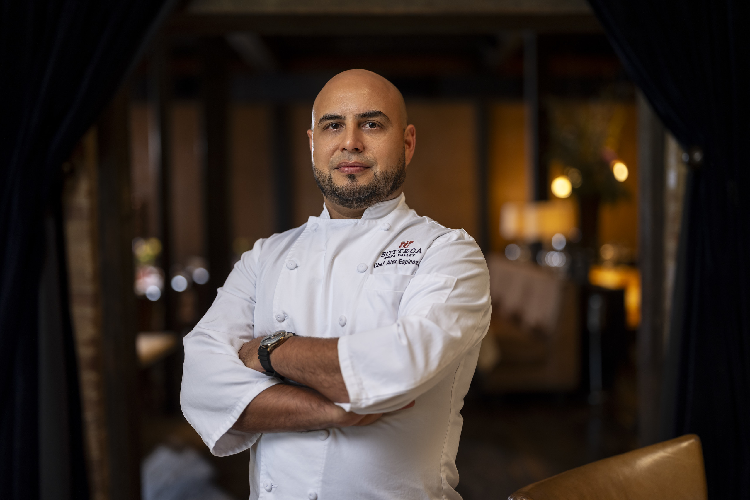 Chef Alex Espinoza standing in Bottega Napa Valley’s dining room.