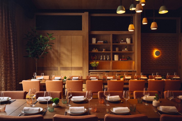 Elegant dining room at Via Aurelia San Francisco with warm lighting and Italian-inspired decor.
