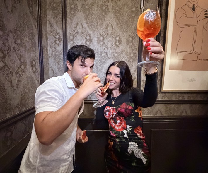 Nadia Caterina Munno raises an Aperol Spritz with a friend during an event at Campari’s New York headquarters.