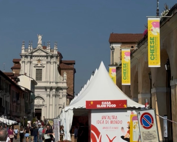 Festival tents and Cheese banners line the streets of Bra with the town’s cathedral in view.