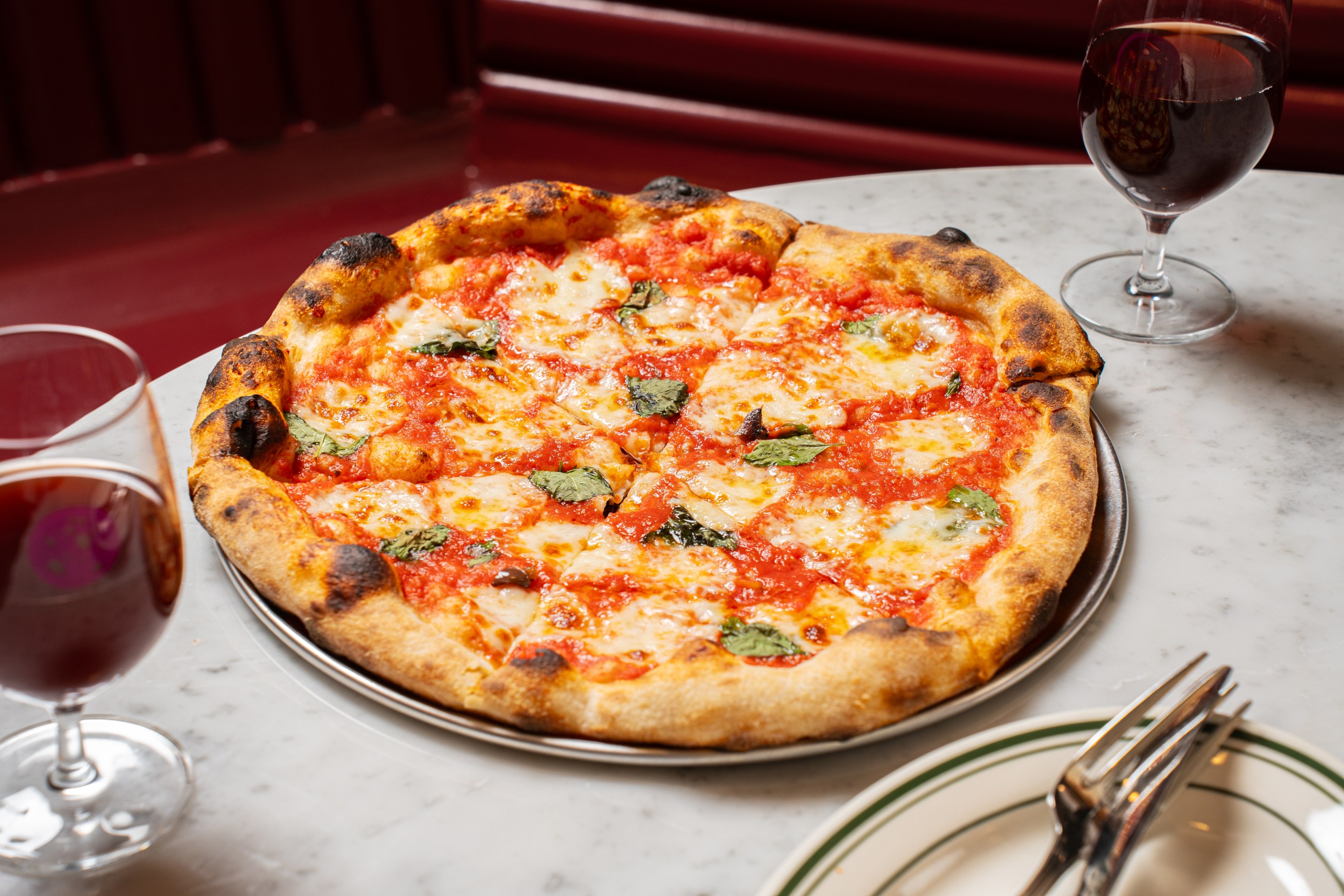 Sourdough Margherita pizza with basil and tomato sauce at Ops East Village.