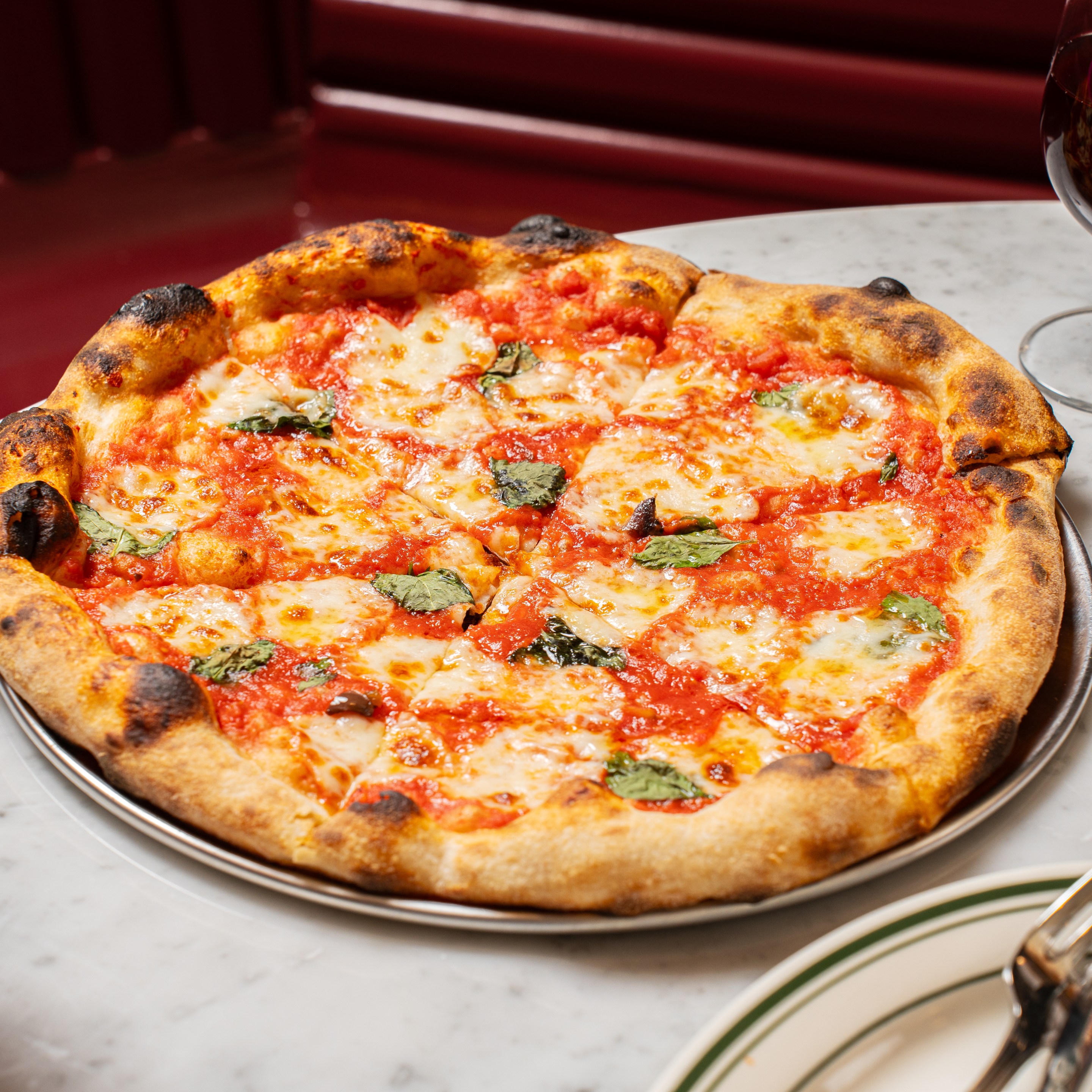 Sourdough Margherita pizza with basil and tomato sauce at Ops East Village.