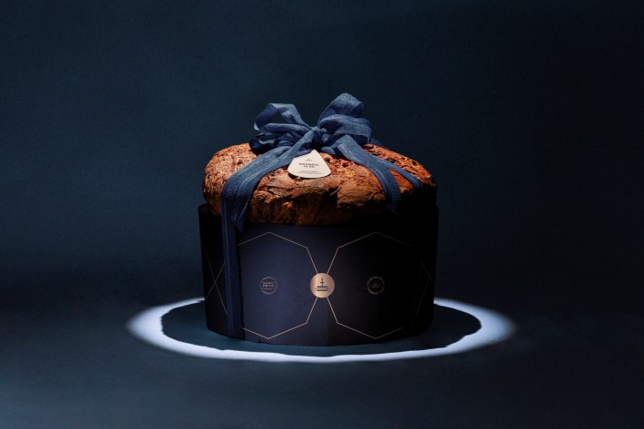 Fiasconaro Panettone Maximus wrapped in navy packaging with ribbon, created as a centerpiece for special occasions.