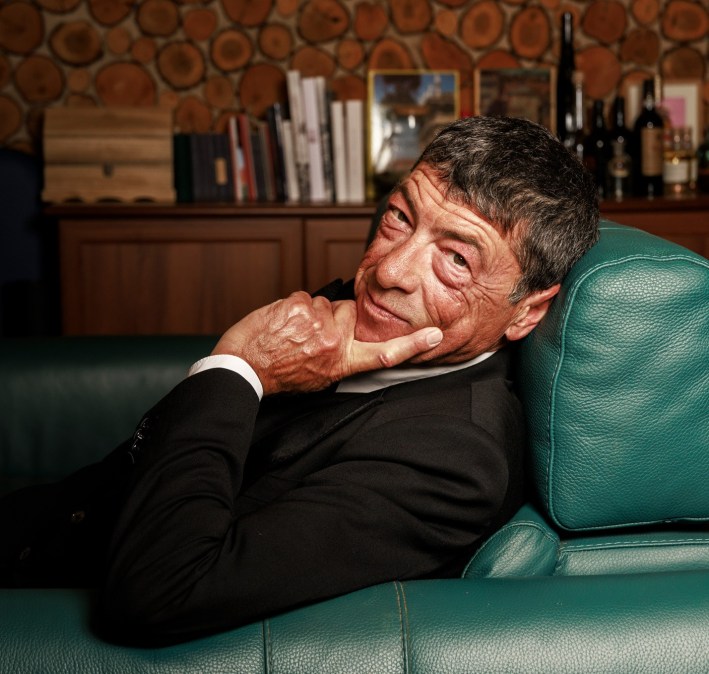 Master Pastry Chef Nicola Fiasconaro relaxing on a green chair, looking at camera.