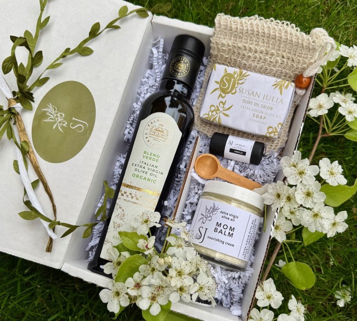 Susan Julia Olive Oil gift box with skincare products, EVOO bottle, and flowers