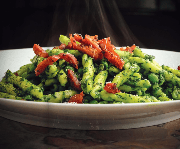 Mark Gowen's Casarecce pasta in a creamy cavolo nero sauce topped with sliced chorizo and peas