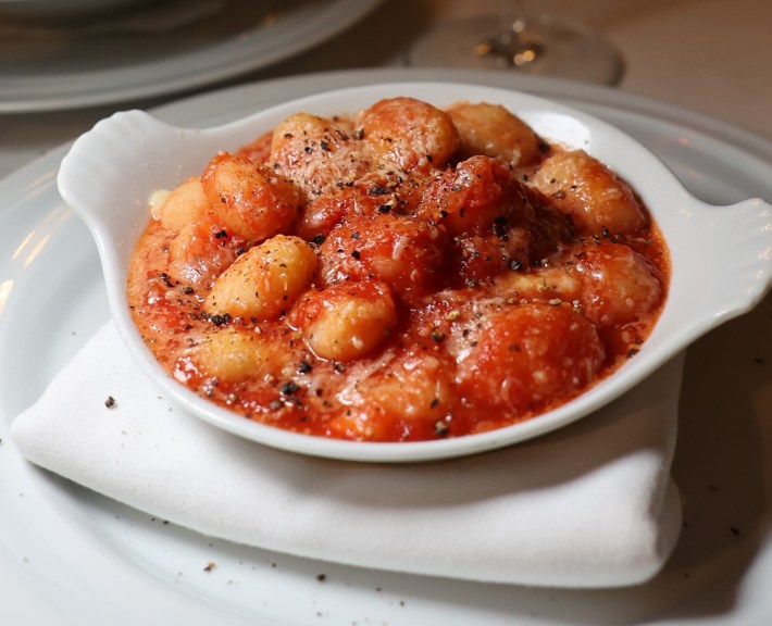 owl of gnocchi in tomato sauce topped with cheese and black pepper at Vette Ristorante.