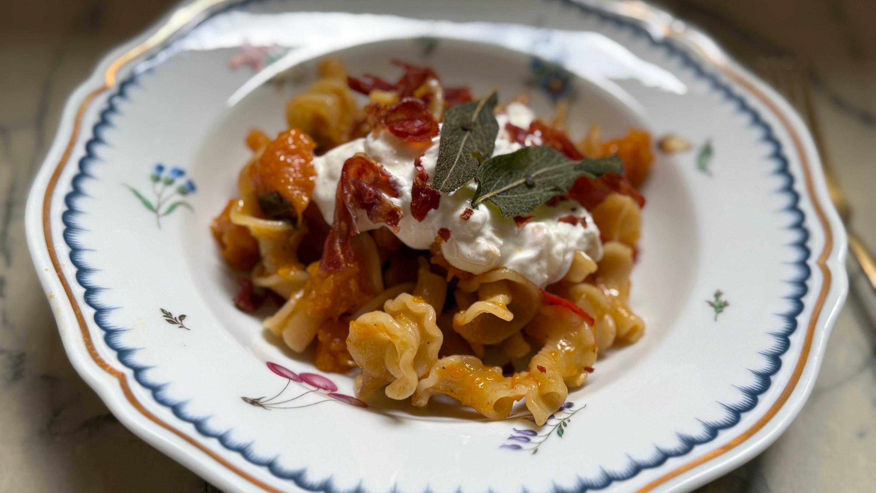 Butternut Squash Pasta with Smoked Lioni Stracciatella, Crispy Sage & Prosciutto by Joanna Moeller.