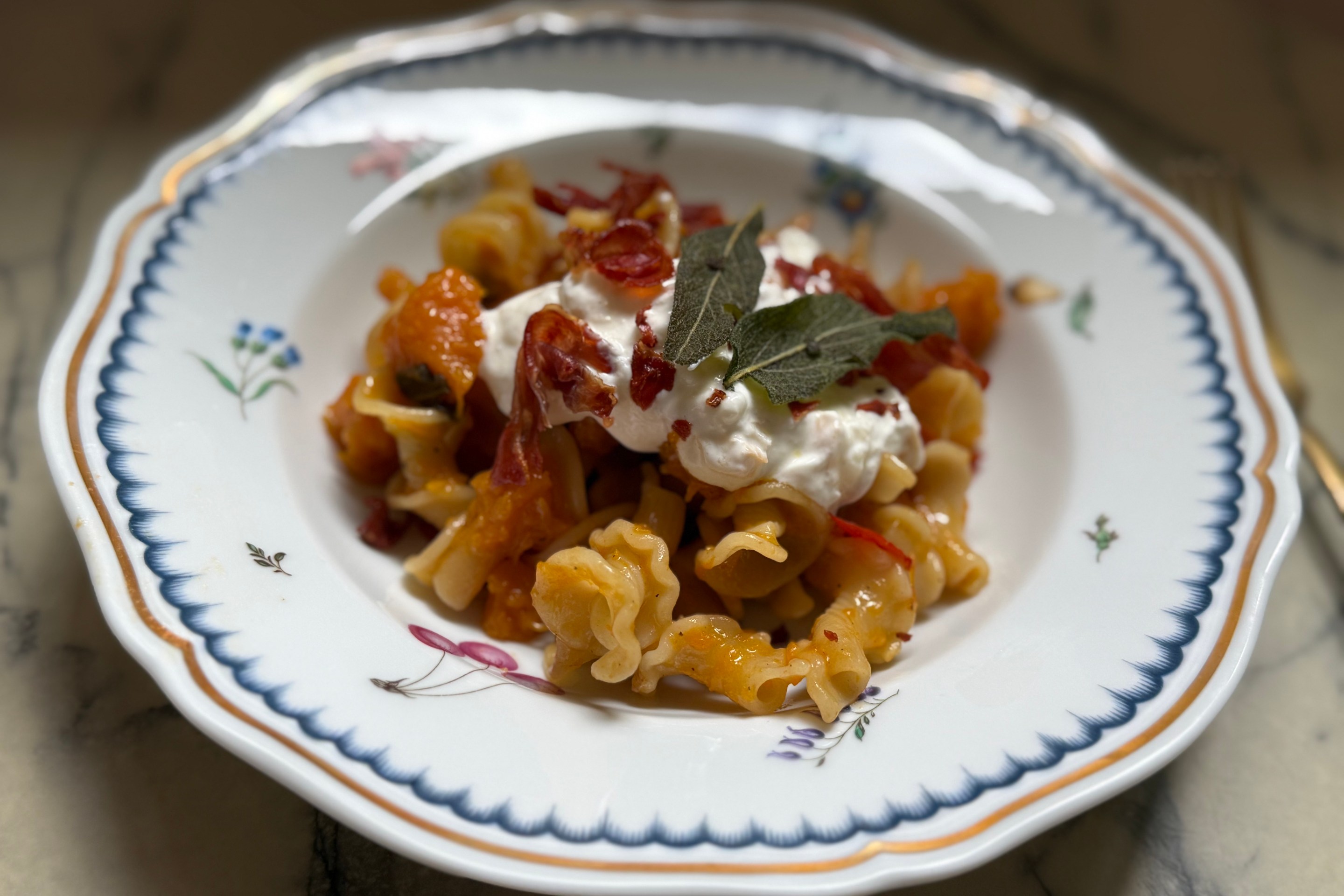 Butternut Squash Pasta with Smoked Lioni Stracciatella, Crispy Sage & Prosciutto by Joanna Moeller.