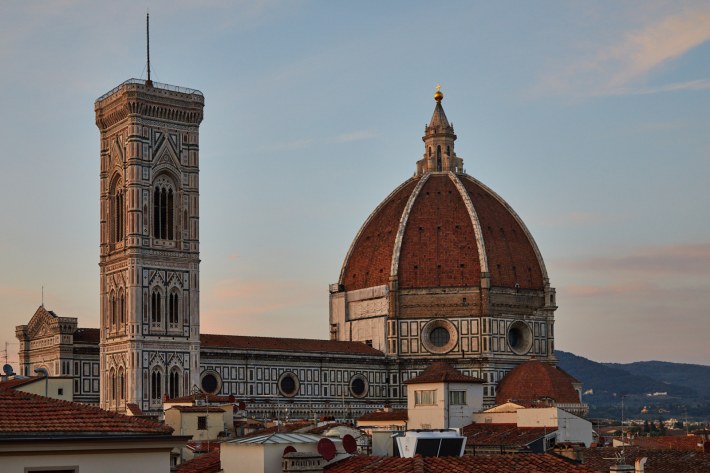 he Florence Cathedral and Giotto’s bell tower at sunset.