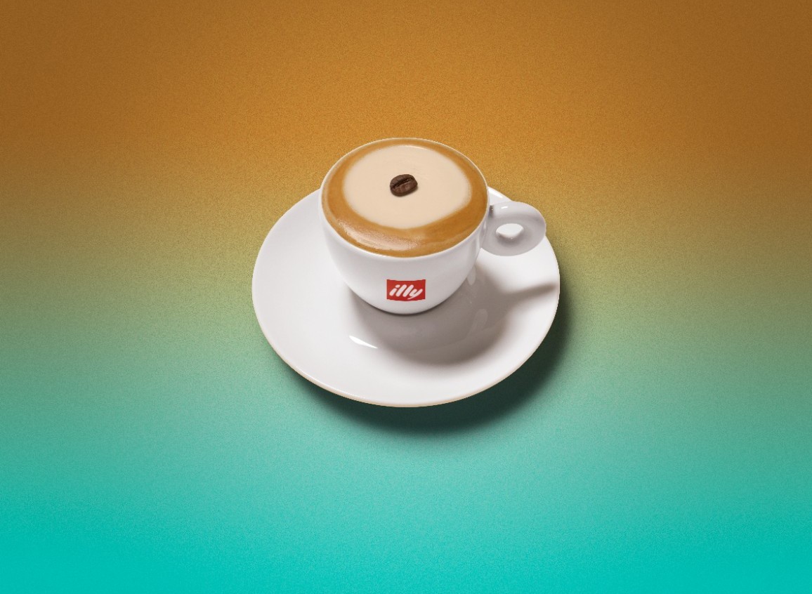 A small Illy espresso cup filled with a Caramellow, topped with caramel cream and a single coffee bean, on a warm gradient background.