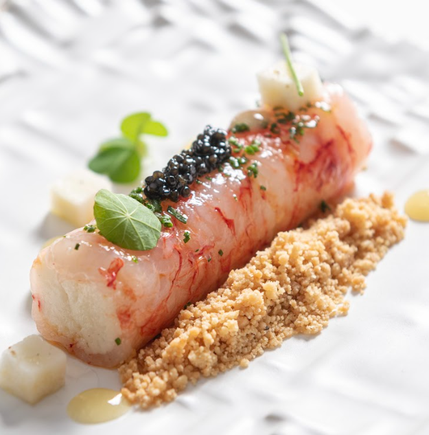 Prawn with fiori di latte, black pepper cracker, caviar, and candied lemon. Photo credit: Favorita Hotel.