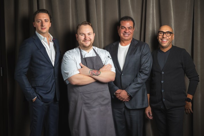 Group portrait of the Dēliz restaurant team inside the Bucktown dining space.