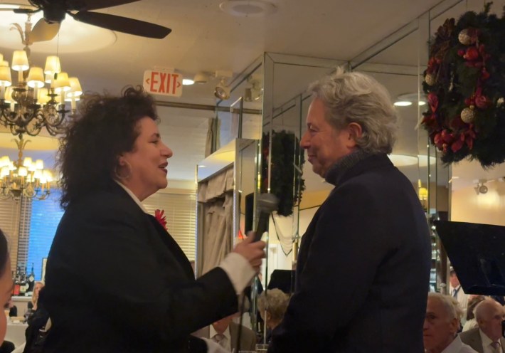 Author Adriana Trigiani speaking with David Lawrence at a Frank Sinatra birthday celebration at Patsy’s Italian Restaurant.