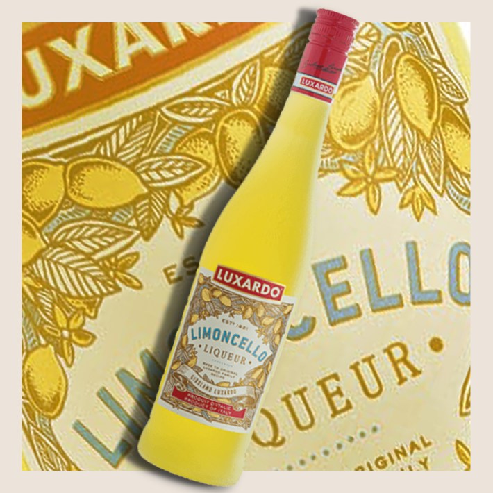 Bottle of Luxardo Limoncello against a lemon-patterned background.