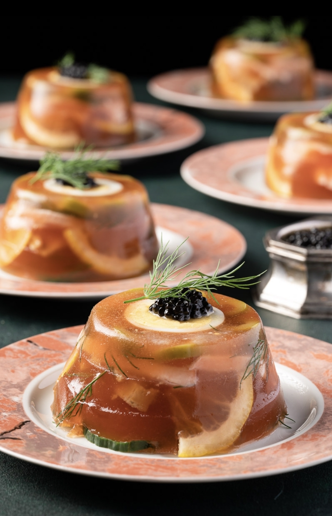 Finished aspic plated and garnished with herbs