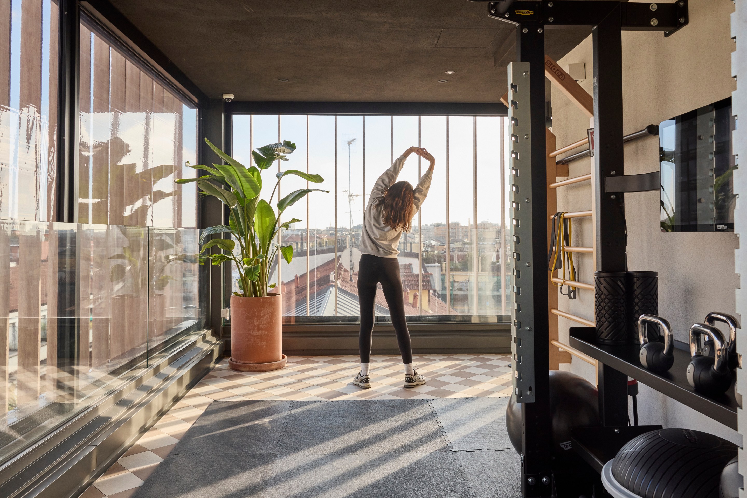 Hotel Calimala Milano fitness room with city view