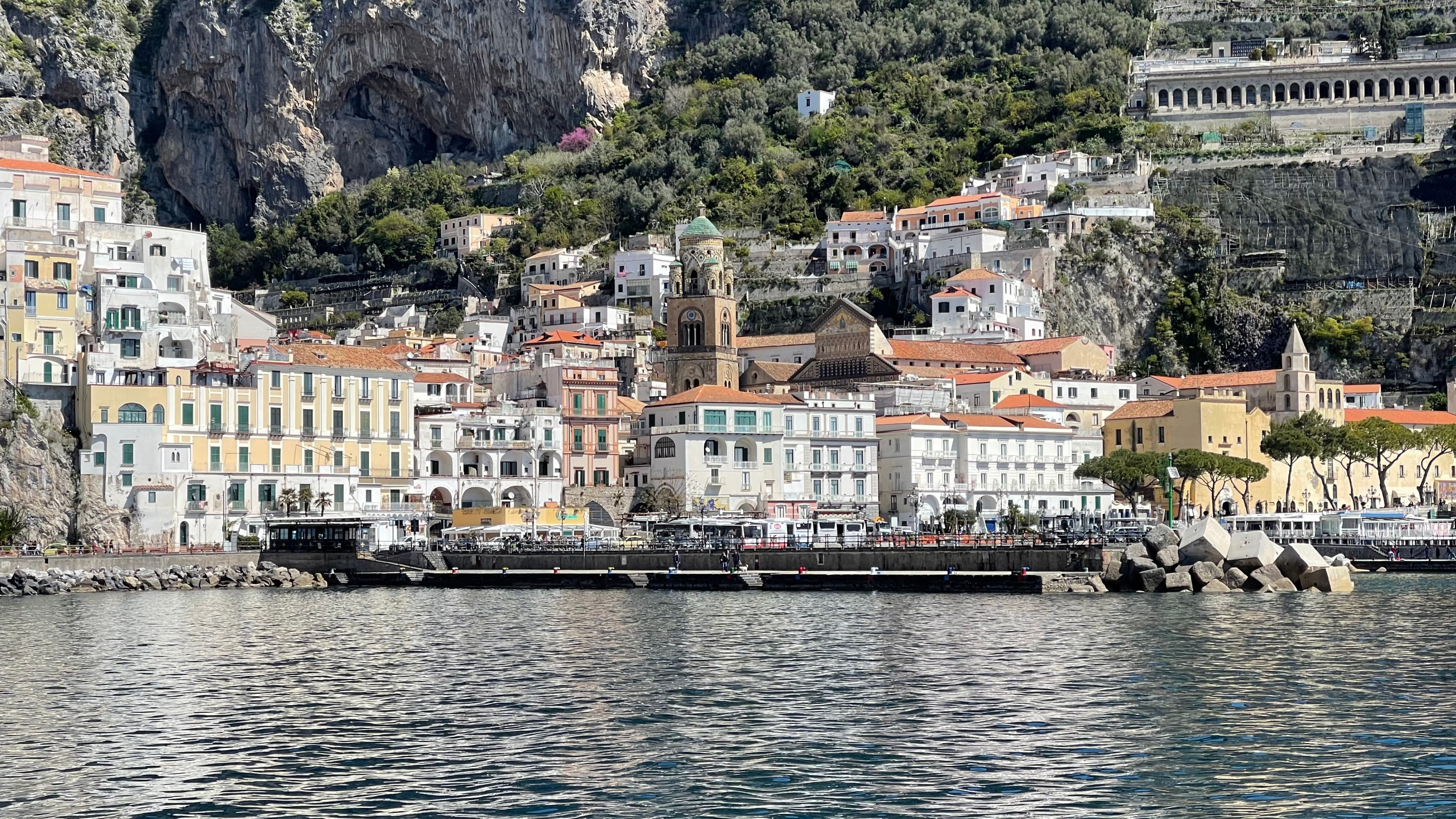 Panoramic view of the Amalfi coastline and historic town overlooking the sea.