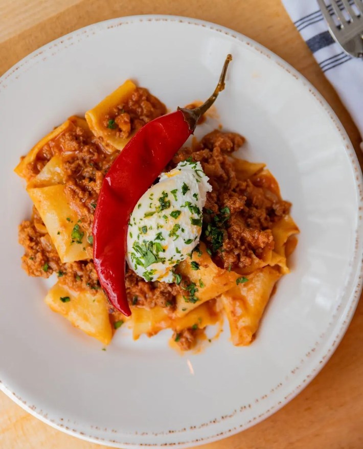 Paccheri pasta with meat ragù and fresh herbs at Ever Andalo.