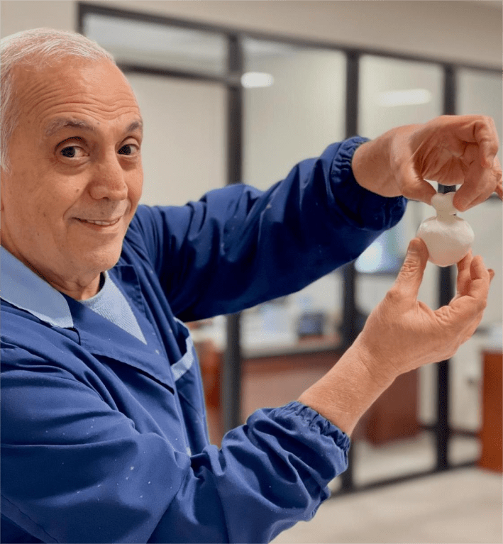 Salvatore Salzarulo proudly displaying his baby burrata at the Lioni production facility in New Jersey.