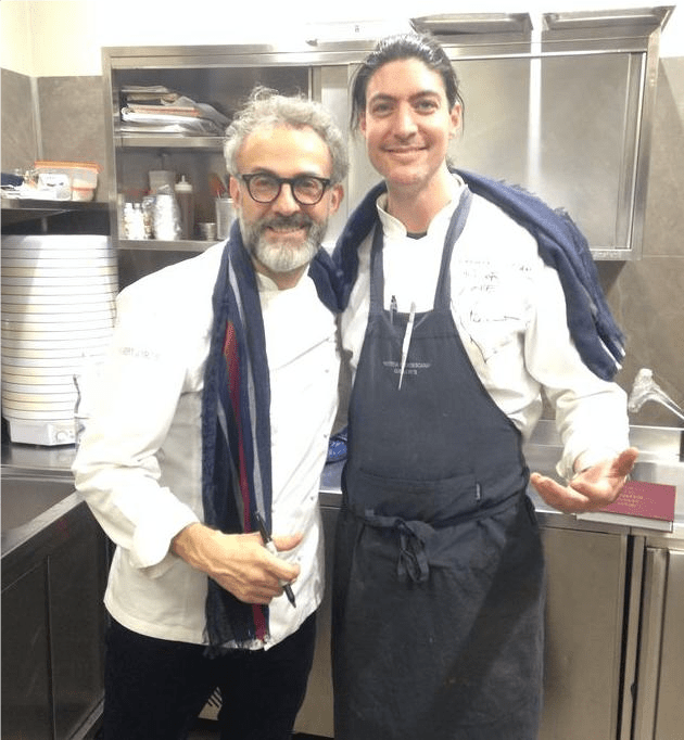 Chef Stefano with Massimo Bottura in the kitchen of Osteria Francescana in Modena.