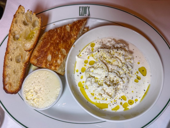 Warm focaccia with housemade stracciatella and cultured butter at Ezio’s Miami Beach
