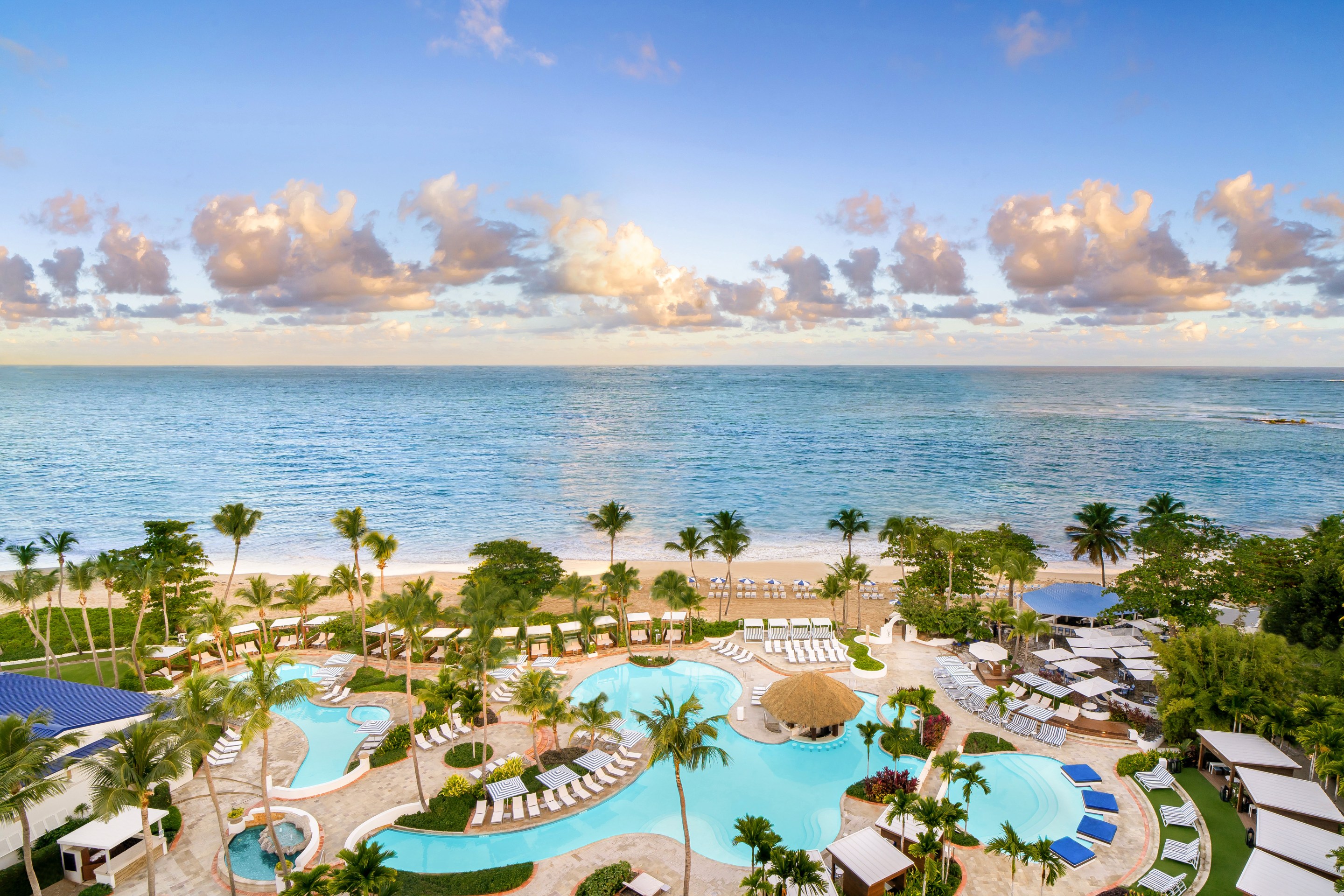 Isla Verde Beach and Signature Pools at Fairmont El San Juan Hotel. Courtesy of Fairmont El San Juan Hotel