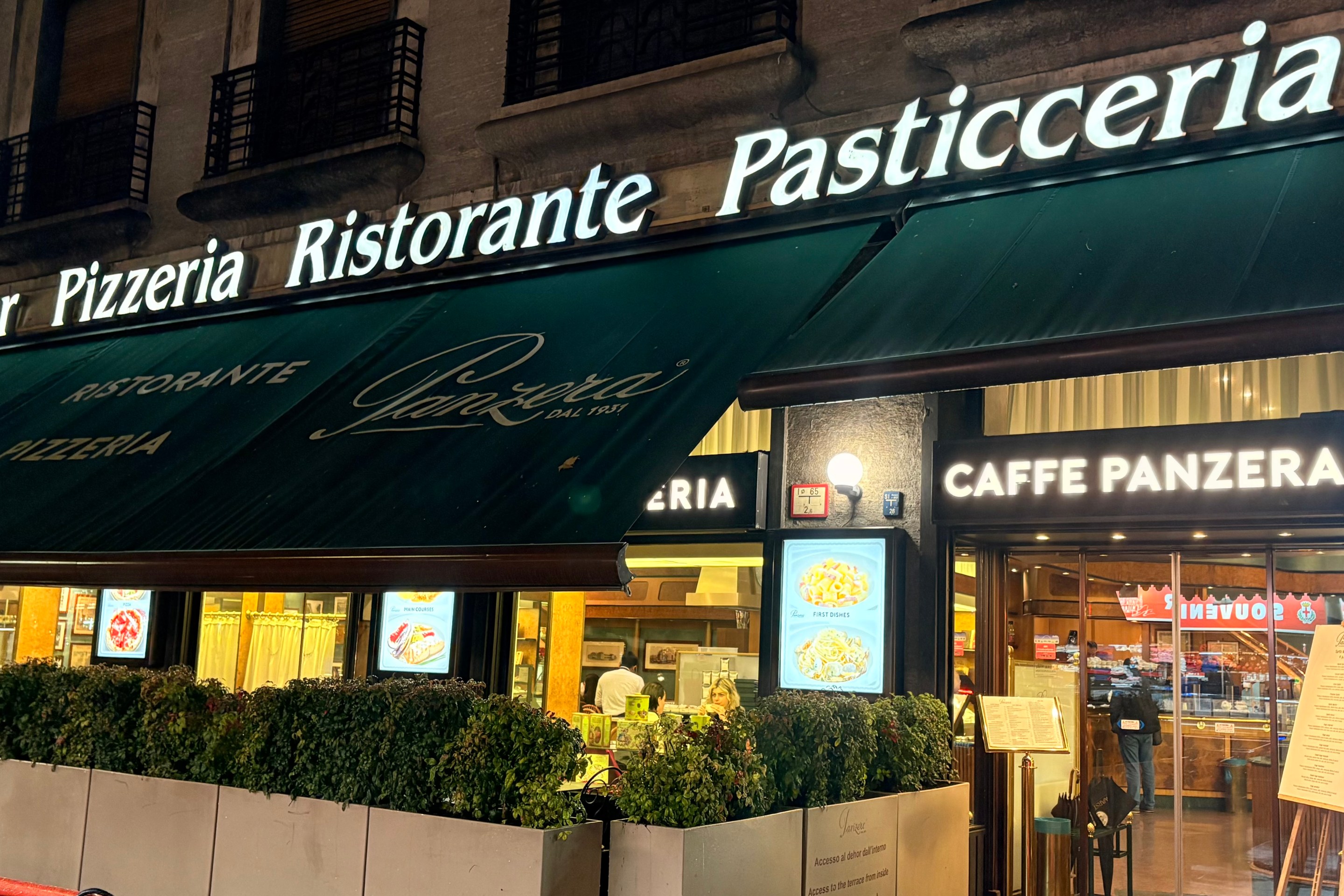 Exterior of Caffe Panzera near Milan Centrale Station at night