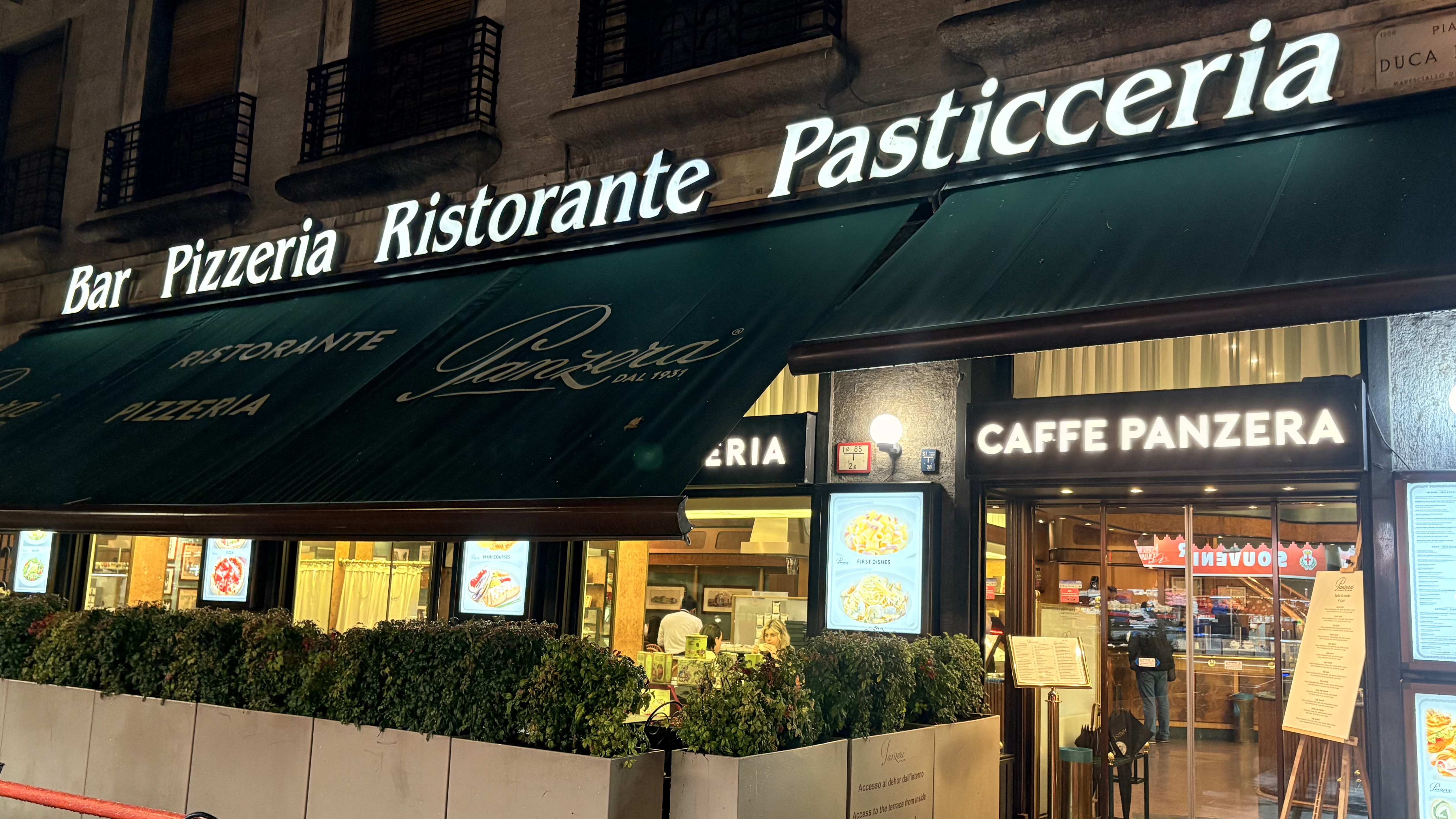 Exterior of Caffe Panzera near Milan Centrale Station at night