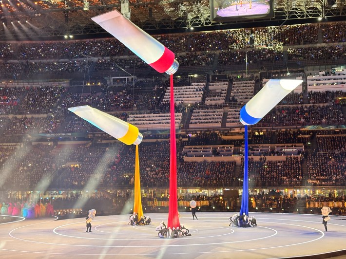 Opening Ceremony performance at Milan Cortina 2026 with colorful paint imagery
