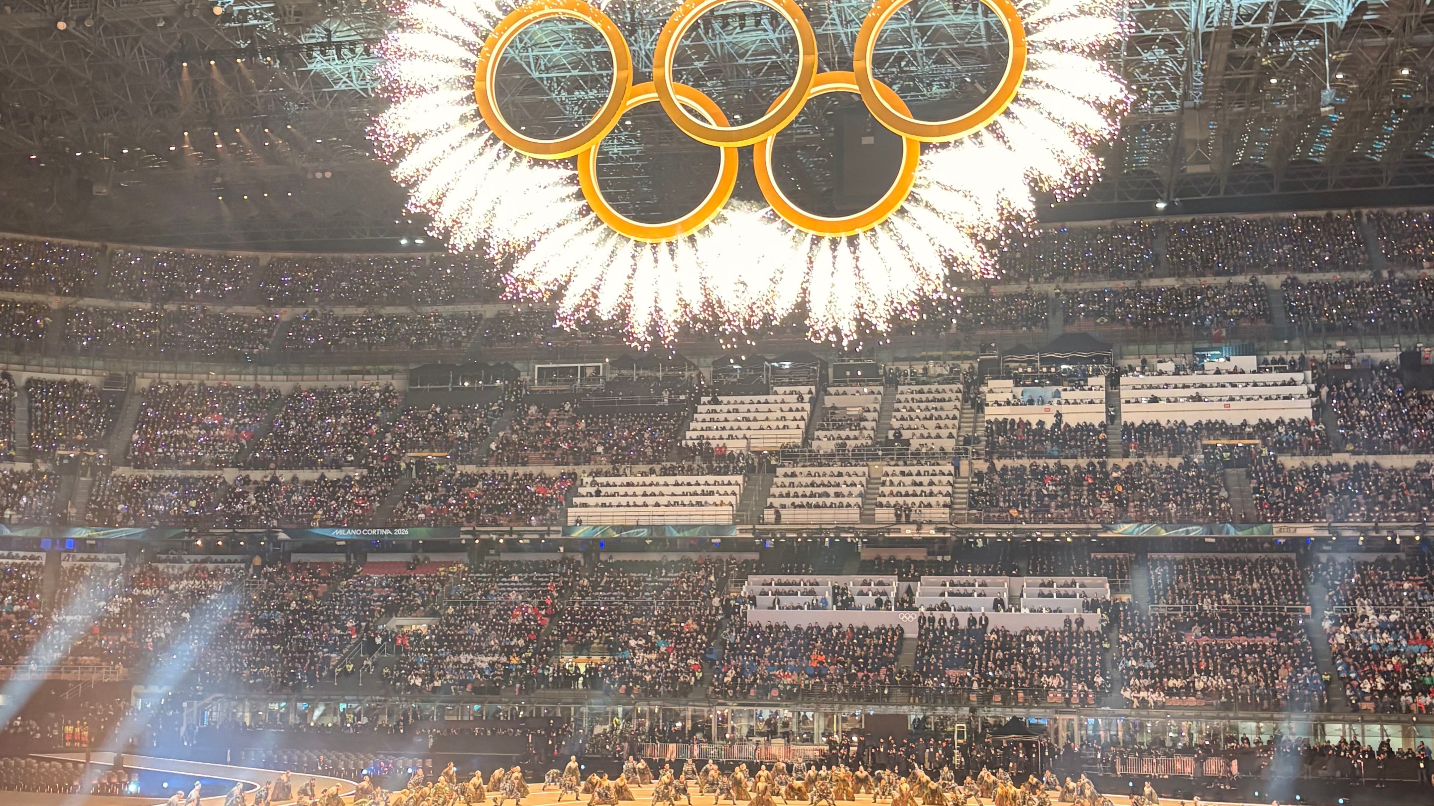 Olympic rings lit inside San Siro Stadium during Opening Ceremony